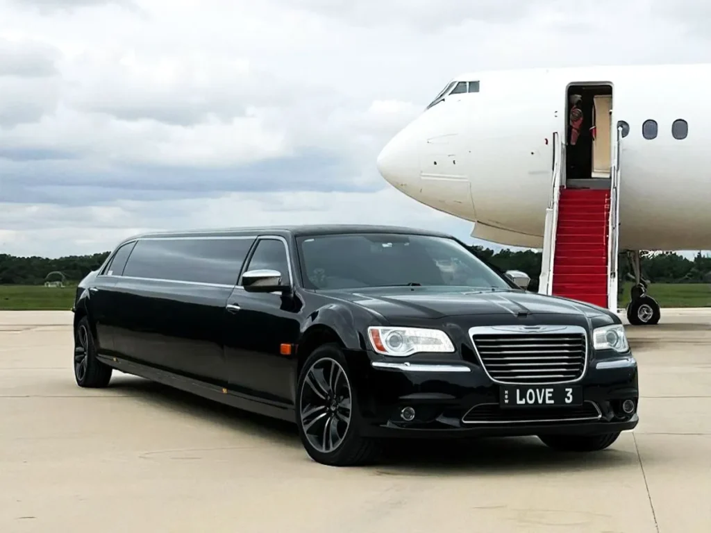 Airport limo service near me with chauffeur meeting passengers on arrival