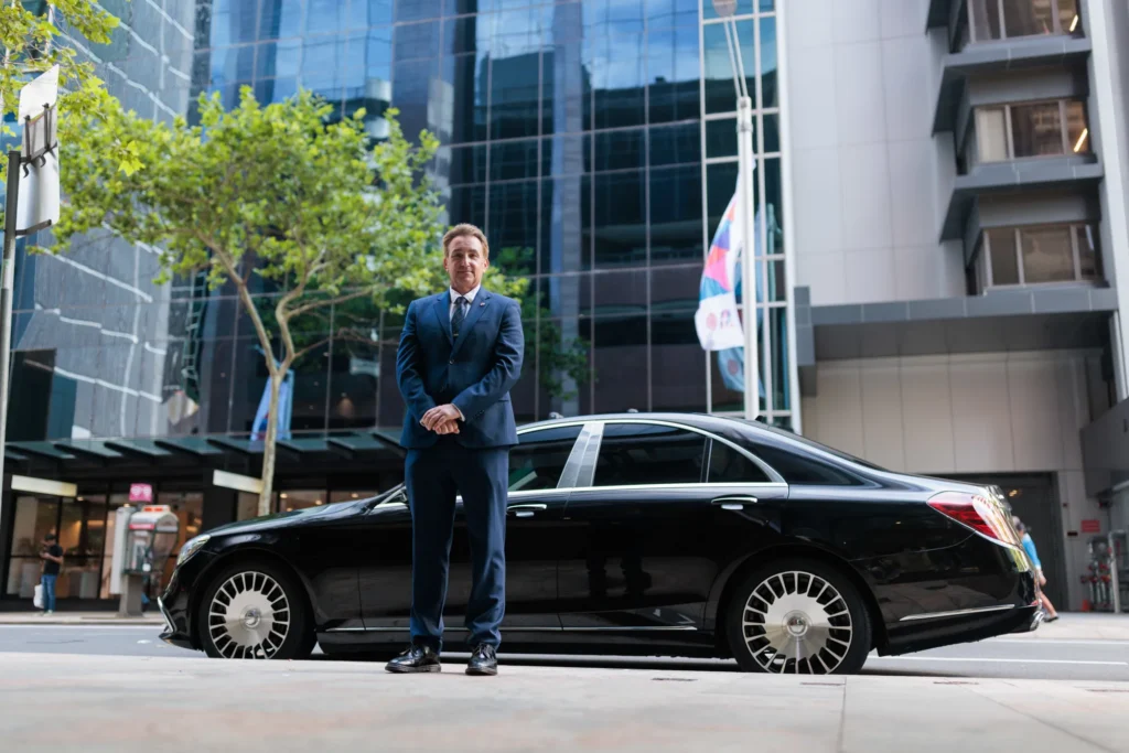 Chauffeur driver navigating Australian city streets in luxury vehicle