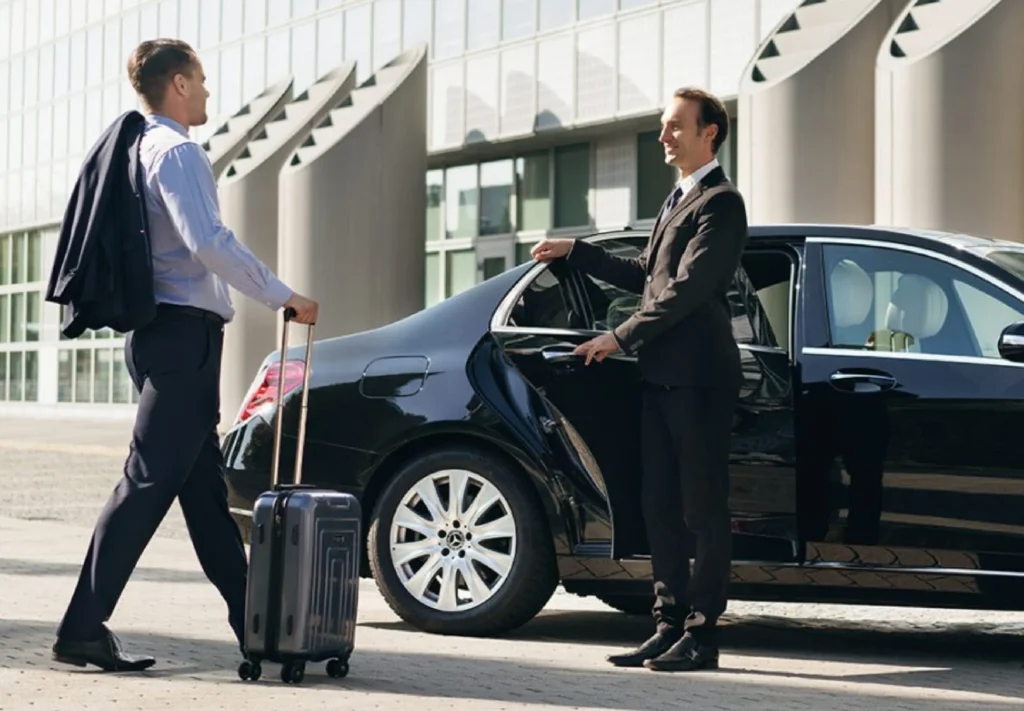 Chauffeur assisting with luggage at Brisbane Airport pickup