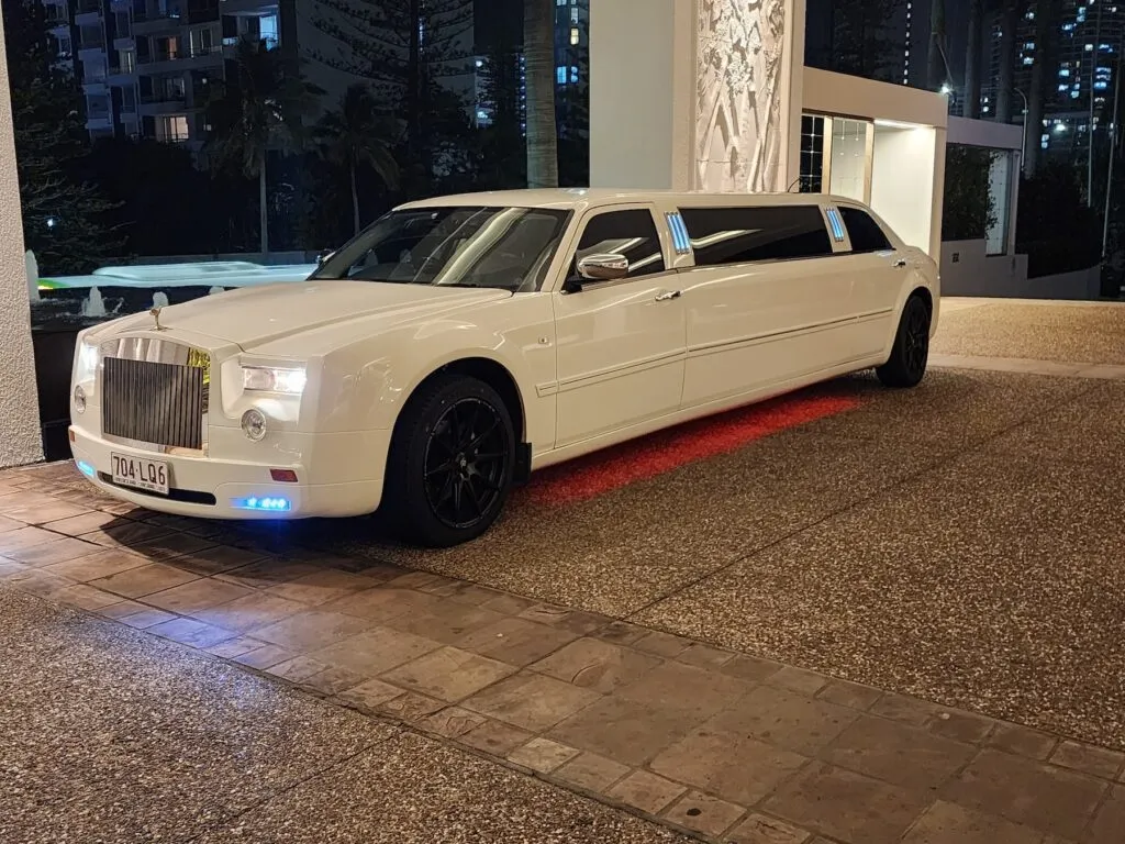 Limousine chauffeur driving through Brisbane city and riverside roads